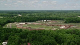 AX106_128 - 4.8K aerial stock footage orbiting Trumbull Correctional Institute Prison Complex in Leavittsburg, Ohio