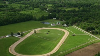 AX106_138 - 4.8K aerial stock footage of ranch and Fields in Newton Falls, Ohio