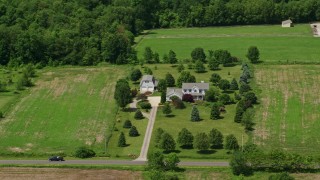 AX106_149 - 4.8K aerial stock footage of a rural home in Hiram, Ohio