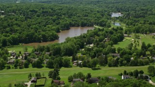 AX106_171E - 4.8K aerial stock footage approaching lakeside homes in Chagrin Falls, Ohio