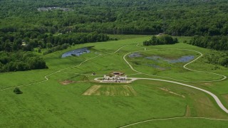 AX106_175 - 4.8K aerial stock footage of green lawns at Frohring Meadows Park, Chagrin Falls, Ohio