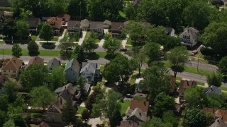 AX106_192E - 4.8K aerial stock footage video of suburban residential neighborhoods in Cleveland, Ohio