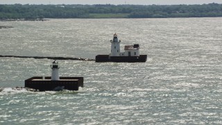 AX106_208 - 4.8K aerial stock footage of two lighthouses on Lake Erie in Cleveland, Ohio