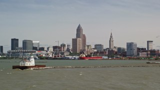 AX106_209E - 4.8K aerial stock footage of the skyline seen from a lighthouse, Downtown Cleveland, Ohio