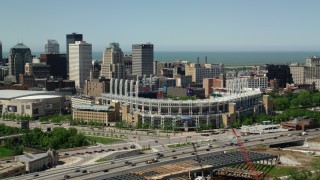 AX106_220 - 4.8K aerial stock footage of Progressive Field baseball stadium in Downtown Cleveland, Ohio