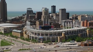AX106_220E - 4.8K aerial stock footage of Progressive Field baseball stadium in Downtown Cleveland, Ohio