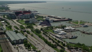 AX106_227 - 4.8K stock footage aerial video of the Rock and Roll Hall of Fame in Downtown Cleveland, Ohio