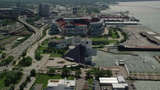 AX106_228 - 4.8K aerial stock footage of Rock and Roll Hall of Fame and FirstEnergy Stadium in Downtown Cleveland, Ohio