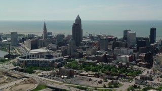 AX106_257 - 4.8K stock footage aerial video of Progressive Field and downtown skyscrapers in Downtown Cleveland, Ohio
