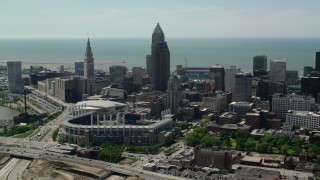 AX106_258 - 4.8K stock footage aerial video approaching Progressive Field and Skyscrapers in Downtown Cleveland, Ohio