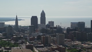 AX107_006E - 4.8K aerial stock footage flying by then approaching Downtown Cleveland skyscrapers, Ohio