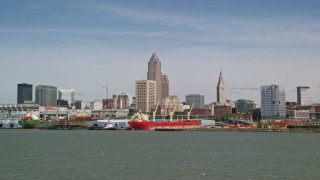 AX107_014E - 4.8K aerial stock footage of Downtown Cleveland skyline seen from Lake Erie, Ohio