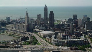 AX107_029 - 4.8K stock footage aerial video flying by Downtown Cleveland from Progressive Field, Ohio