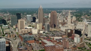 AX107_037 - 4.8K stock footage aerial video passing Downtown Cleveland skyscrapers and high-rises, Ohio