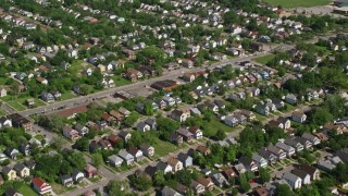 AX107_050E - 4.8K aerial stock footage flying over residential neighborhood, Cleveland, Ohio