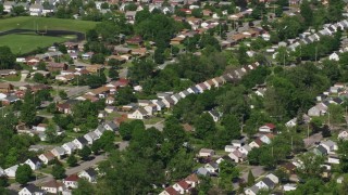 AX107_054E - 4.8K aerial stock footage of suburban homes and trees, Cleveland, Ohio