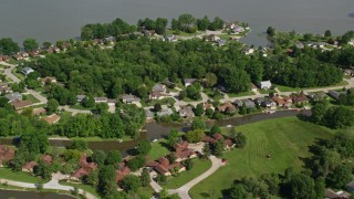 AX107_069 - 4.8K aerial stock footage flying over lakeside homes, Aurora, Ohio