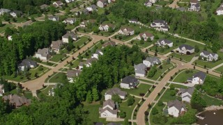 AX107_070E - 4.8K aerial stock footage of upscale homes near the water, Aurora, Ohio
