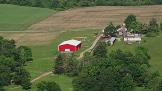 AX107_078E - 4.8K aerial stock footage of a farm with a red barn, Aurora, Ohio