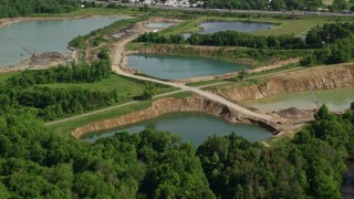 AX107_083 - 4.8K aerial stock footage of small lakes, Ravenna, Ohio