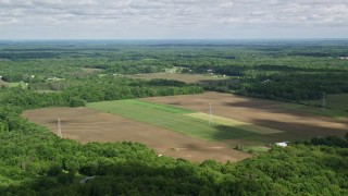 AX107_086E - 4.8K aerial stock footage of farms and trees, Ravenna, Ohio