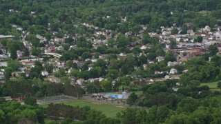 AX107_115E - 4.8K aerial stock footage flying by small town, East Palestine, Ohio