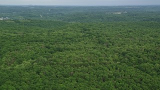 AX107_118E - 4.8K aerial stock footage flying over forests, Darlington, Pennsylvania