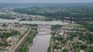 AX107_132E - 4.8K aerial stock footage of three bridges spanning a river near a town, Beaver, Pennsylvania