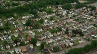 AX107_141 - 4.8K aerial stock footage flying over suburban homes, Conway, Pennsylvania
