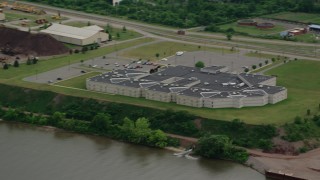 AX107_142 - 4.8K aerial stock footage orbiting Beaver County Jail, Aliquippa, Pennsylvania