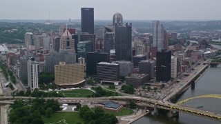 AX107_172E - 4.8K aerial stock footage of Point State Park and skyscrapers, Downtown Pittsburgh, Pennsylvania