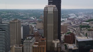 AX107_175E - 4.8K aerial stock footage passing by skyscrapers, Downtown Pittsburgh, Pennsylvania