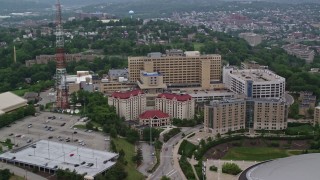 AX107_181 - 4.8K aerial stock footage of Sutherland Hall dormitory and VA Pittsburgh Healthcare System, Pennsylvania