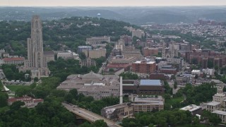 AX107_187 - 4.8K aerial stock footage of University of Pittsburgh campus and Cathedral of Learning, Pennsylvania