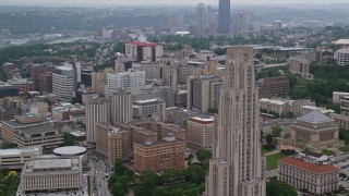 AX107_190 - 4.8K aerial stock footage flying by University of Pittsburgh campus, Pennsylvania