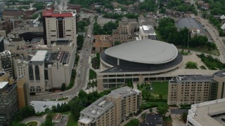AX107_192 - 4.8K stock footage aerial video tilting down on Petersen Events Center, University of Pittsburgh
