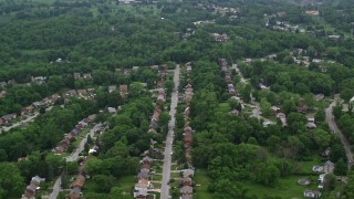 AX107_209 - 4.8K aerial stock footage of suburban neighborhoods and trees, Penn Hills, Pennsylvania