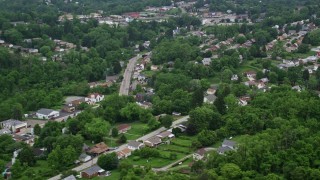 AX107_210E - 4.8K aerial stock footage of suburban homes and trees, Penn Hills, Pennsylvania