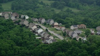 AX107_212 - 4.8K aerial stock footage approaching a residential neighborhood, Penn Hills, Pennsylvania