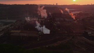 AX108_016 - 4K aerial stock footage of U.S. Steel Mon Valley Works, Braddock, Pennsylvania, sunet