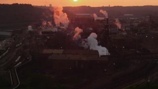 AX108_017 - 4K aerial stock footage passing by U.S. Steel Mon Valley Works, Braddock, Pennsylvania, sunset