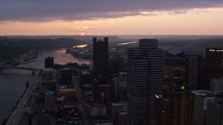AX108_079 - 4K aerial stock footage of Fort Pitt Bridge spanning Ohio River, Downtown Pittsburgh, Pennsylvania, twilight