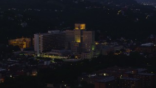 AX108_146 - 4K stock footage aerial video approaching Allegheny General Hospital, Pittsburgh, Pennsylvania, night