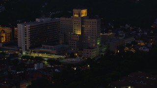 AX108_147 - 4K aerial stock footage approaching Allegheny General Hospital, Pittsburgh, Pennsylvania, night
