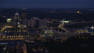 AX108_152 - 4K stock footage aerial video flying by Downtown Pittsburgh revealing Point State Park, Pennsylvania, night