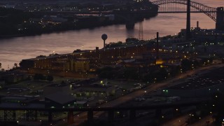 AX108_155 - 4K stock footage aerial video of Western State Penitentiary along the river, Pittsburgh, Pennsylvania, twilight