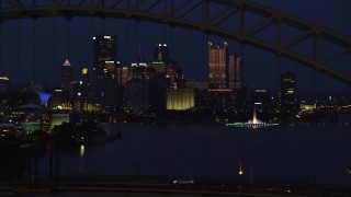 AX108_165 - 4K aerial stock footage of Downtown Pittsburgh skyscrapers and Point State Park; night