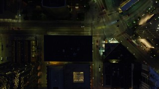 AX108_180E - 4K aerial stock footage of a bird's eye of Forbes Avenue and buildings Downtown Pittsburgh, Pennsylvania, night