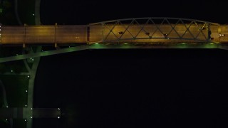 AX108_185 - 4K aerial stock footage of a bird's eye orbiting Fort Duquesne Bridge, Downtown Pittsburgh, night