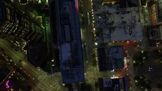 AX108_186E - 4K aerial stock footage of a bird's eye of city streets, Downtown Pittsburgh, Pennsylvania, night